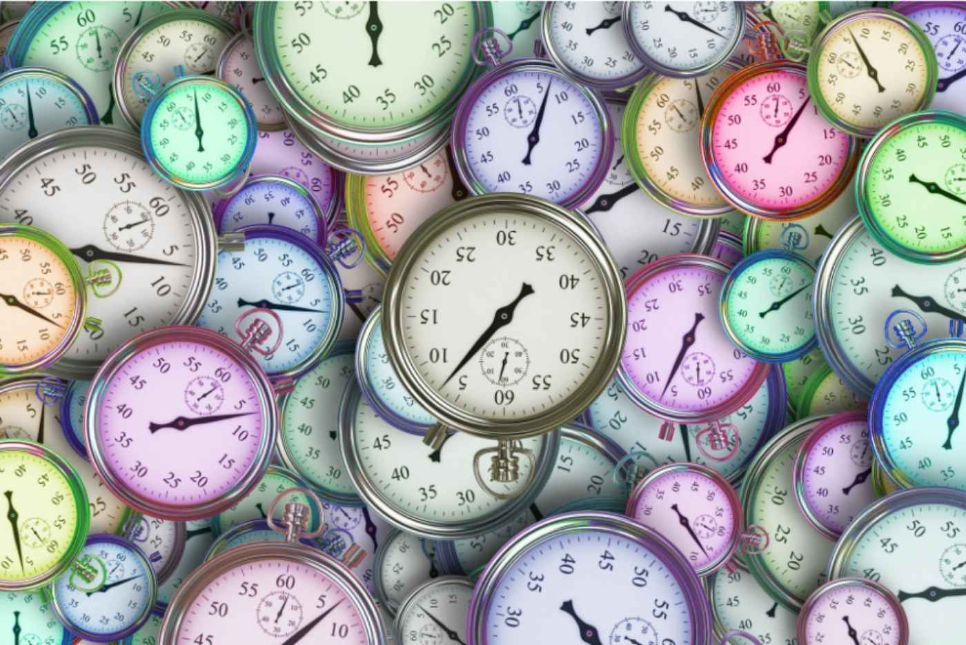 colourful clocks stacked on top of each other in a pile